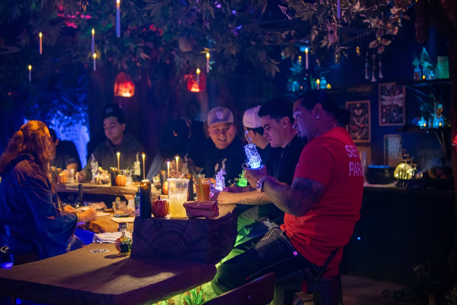 A group around the long candlelit table in Everburn Woods